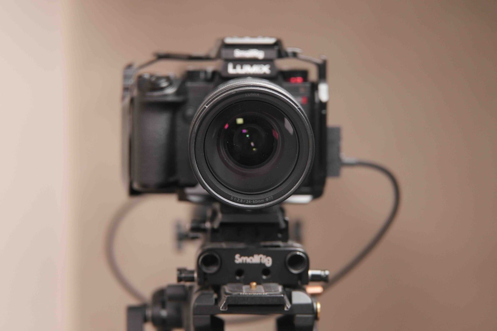 A Lumix camera in a SmallRig cage on its tripod at Myriad Studios, ready to film